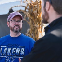 Man looking at other man while talking